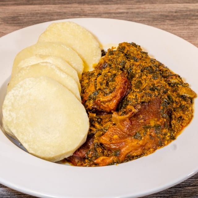 D16. Spinach & Egusi Soup with Yam.